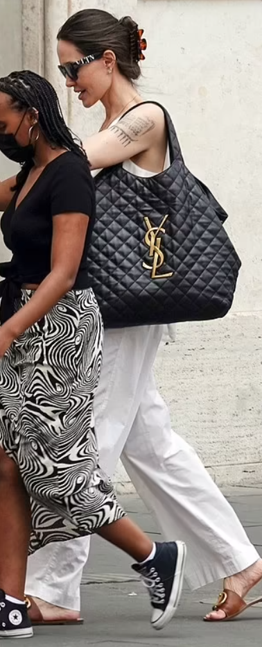 Angelina Jolie style with YSL handbag