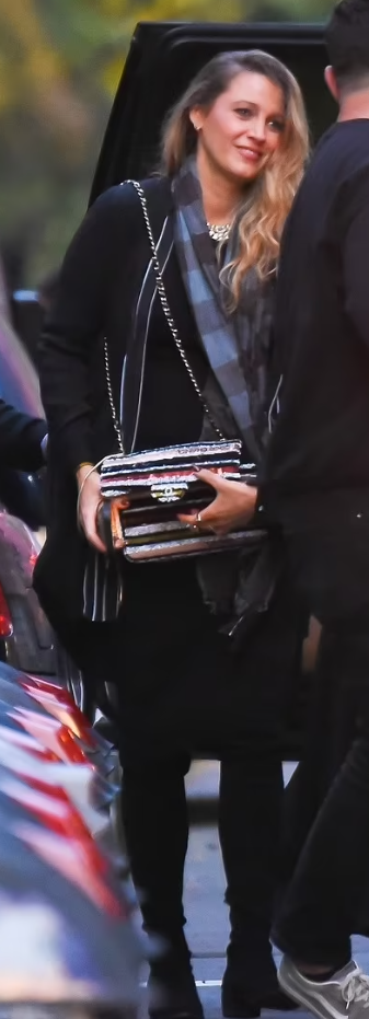Model Bella Hadid is seen wearing Chanel bag, checkered scarf