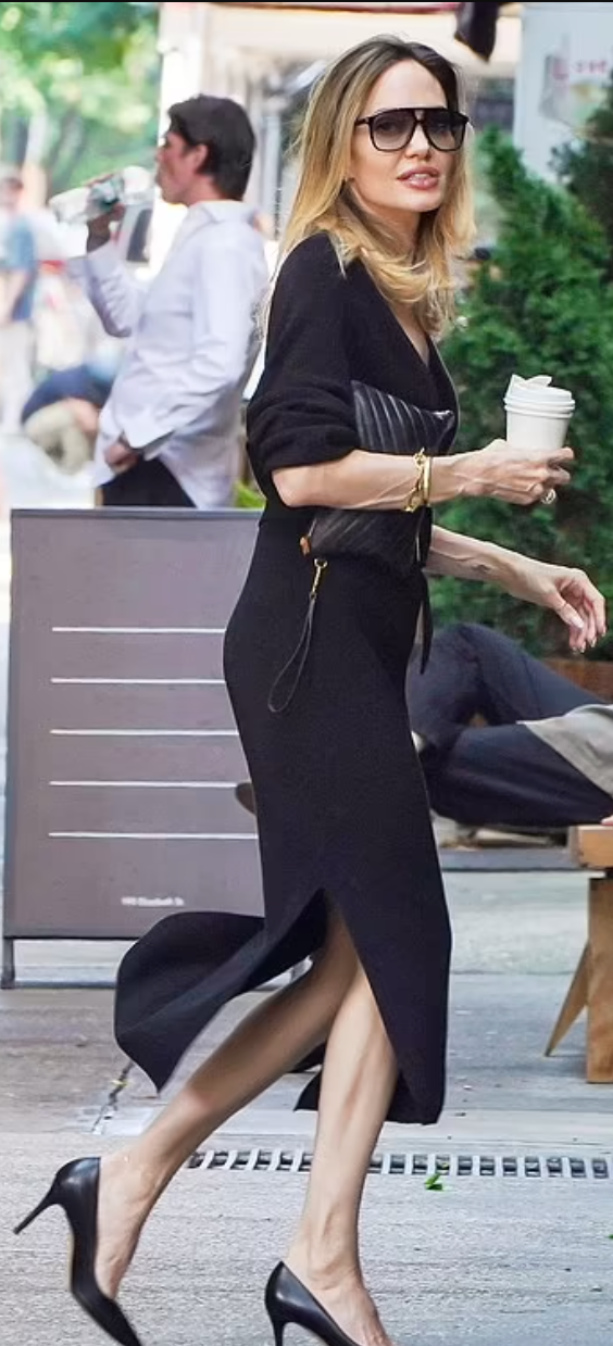 Who made Angelina Jolie's black sunglasses and print handbag